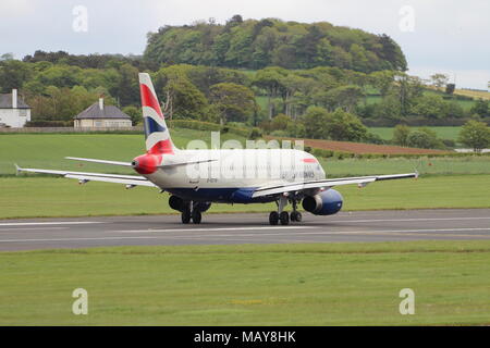 G-EUYB, un Airbus A320-232 exploité par British Airways, à l'aéroport de Prestwick en Ayrshire. Banque D'Images