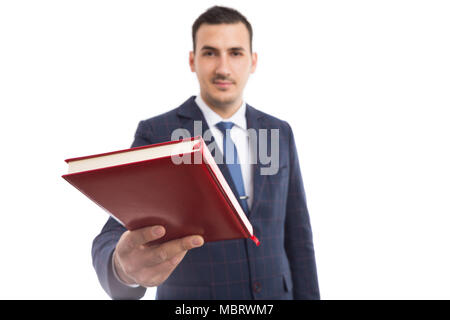 Jeune pasteur ou prédicateur de la bible ou portable rouge donnant la foi comme concept isolé sur fond blanc Banque D'Images