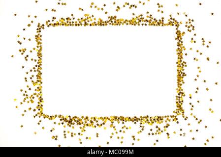 Les paillettes d'or en forme d'étoile frame disposés dans une forme rectangulaire. Banque D'Images