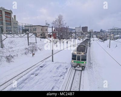 Snow railtrack and train in Otoru city Hokkaido Japan mid Winter Banque D'Images