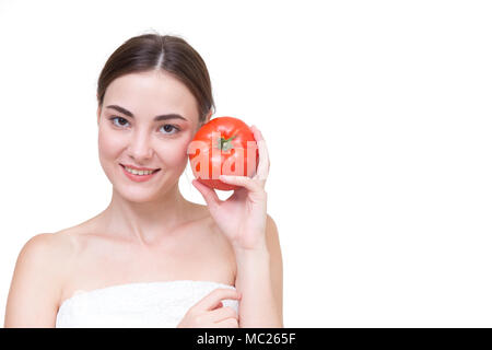 De belles femmes avec de la tomate isolated on white Banque D'Images