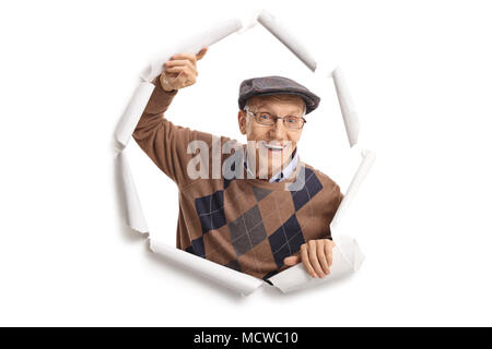 Cheerful man Breaking through paper Banque D'Images