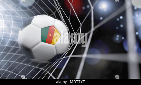 Le rendu très réaliste d'un ballon de foot avec le drapeau du Cameroun sur le net.(série) Banque D'Images