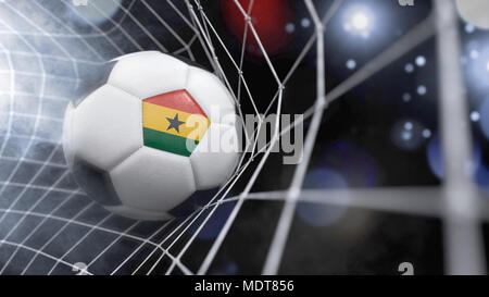 Le rendu très réaliste d'un ballon de foot avec le drapeau du Ghana dans le net.(série) Banque D'Images