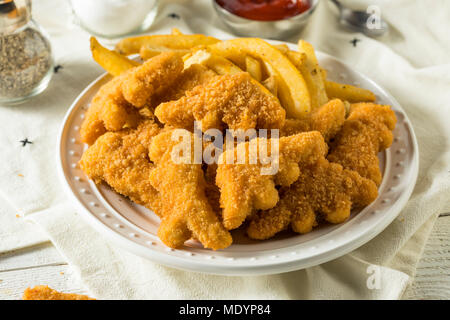 Les enfants en forme de dinosaures Nuggets de poulet prêt à manger Banque D'Images