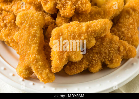 Les enfants en forme de dinosaures Nuggets de poulet prêt à manger Banque D'Images