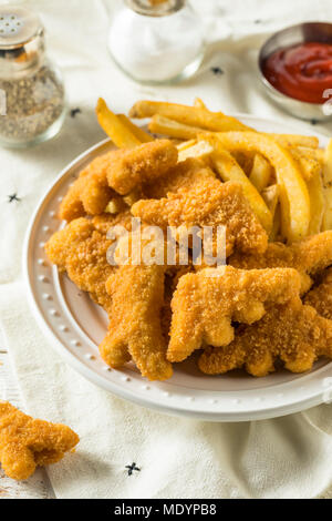 Les enfants en forme de dinosaures Nuggets de poulet prêt à manger Banque D'Images