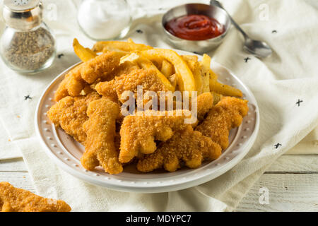 Les enfants en forme de dinosaures Nuggets de poulet prêt à manger Banque D'Images