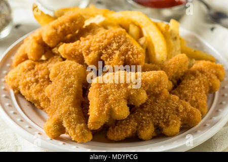 Les enfants en forme de dinosaures Nuggets de poulet prêt à manger Banque D'Images