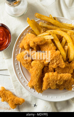 Les enfants en forme de dinosaures Nuggets de poulet prêt à manger Banque D'Images