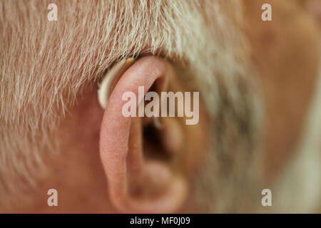 Close-up of senior man with hearing aid Banque D'Images