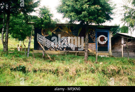 Une murale sur un bâtiment à Oventic, Chiapas, Mexique, Etat proclame l'importance historique de maïs (maïs) à la zone des populations autochtones de la population maya. Banque D'Images