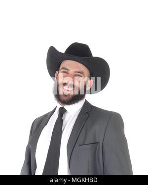 Un portrait libre d'un bel homme en costume et chapeau de cowboy, avec une barbe et moustache, smiling, isolée pour fond blanc Banque D'Images