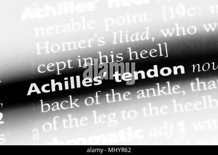 Le tendon d'achille mot dans un dictionnaire. Concept du tendon d'Achille. Banque D'Images