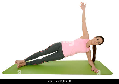 Young woman doing yoga asana Vasisthasana ,Planche latérale Banque D'Images