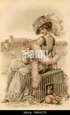 Femme assise sur une cage de lapins Banque D'Images