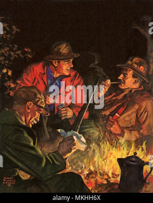 Les hommes autour de feu de camp Banque D'Images