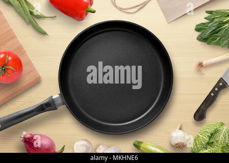 Pan est entourée de légumes et aliments de la cuisine végétarienne. Légumes frais sur la table de la cuisine. Vue d'en haut. Banque D'Images