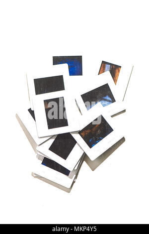 Quelques vieilles diapositives sur un fond blanc. Banque D'Images
