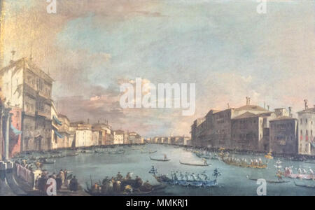 . Anglais : Grand Canal du Palazzo Balbi. Au loin le Pont du Rialto, clocher de l'église de San Bartolomeo, et dôme de l'église de Santi Giovanni e Paolo peut être vu. Au premier plan, le paleto de la traditionnelle régate Ventian a lieu, c'est pourquoi les bateaux se tournent autour et les foules se réjouissent. Régate à Venise. vers 1770. Photographie de Guardi's Regatta à Venise à la Frick Art Reference Library Banque D'Images