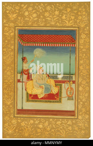 . Anglais : Un portrait de Takoji Holkar fumer un narguilé sous un auvent, l'Inde, Delhi, début xixe siècle Estimation : 2 000 - 3 000 GBP LOT vendu. 6 000 EUR (prix marteau avec la prime de l'acheteur) Gouache sur papier avec de l'or, l'inscription d'identification en nast'aliq au centre supérieur 'Howalkar Takoji Subedar', monté sur une page d'album avec des bordures de papier crème épaisse décorée de fleurs d'or, marche arrière avec une inscription dans une main dans l'encre brune (probablement de la main de William Fraser) 'Tukojee Holker' peinture : 28 par 19cm. Feuilles : 45,9 30,4 cm par. . Au début du xixe siècle. L'Inde, Delhi 21 Un portrait de Ta Banque D'Images