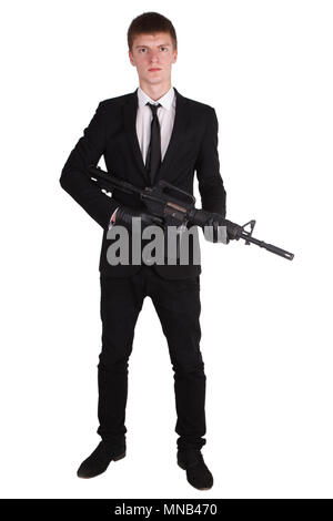 L'homme en costume noir et d'un fusil isolated on white Banque D'Images