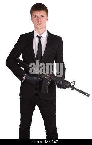 L'homme en costume noir et d'un fusil isolated on white Banque D'Images