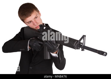 L'homme en costume noir et d'un fusil isolated on white Banque D'Images