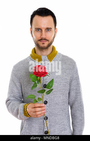 Portrait of young man holding red rose prêt pour la Saint-Valentin Banque D'Images