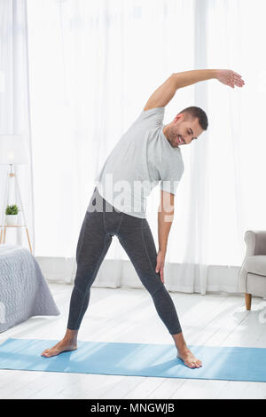 Nice cheerful man working out Banque D'Images