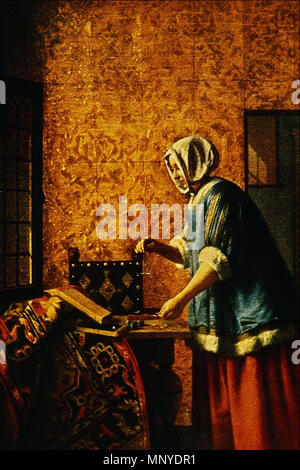 Intérieur avec une femme pesant monnaie d'Or . Femme pesant environ 1664 or .. 1272 Femme pesant l'or - Pieter de Hooch Banque D'Images