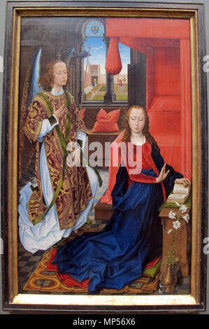 L'annonciation . Anglais : sur un design par Rogier van der Weyden, probablement commandé par un membre de la famille de Clugny, dont les armoiries-les deux clés-décore le tapis et le vitrail. . Entre 1465 et 1475 circa circa. 883 Hans Memling, annunciazione, CA 1465-75. Banque D'Images