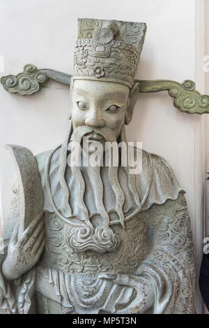 Le visage d'une sculpture dans le parc du Wat Pho (Temple du Bouddha couché de la), ou Wat Phra Chetuphon Bangkok Thaïlande Banque D'Images