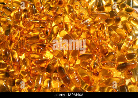 L'huile de foie de morue capsules background Banque D'Images