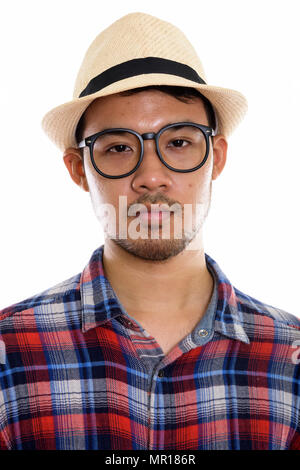 Visage de jeune homme portant des lunettes et un chapeau Banque D'Images