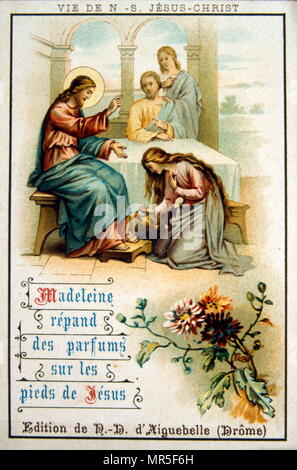 Carte de Noël français montrant la lave les pieds de Jésus par Marie Magdalena. 1900 Banque D'Images