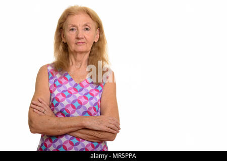 Studio shot of senior woman with arms crossed Banque D'Images