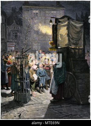 Les enfants regardant un Punch and Judy show sur une rue de Londres, 1800. À la main, gravure sur bois Banque D'Images