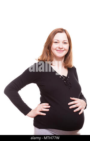 Smiling pregnant woman isolated over white background Banque D'Images