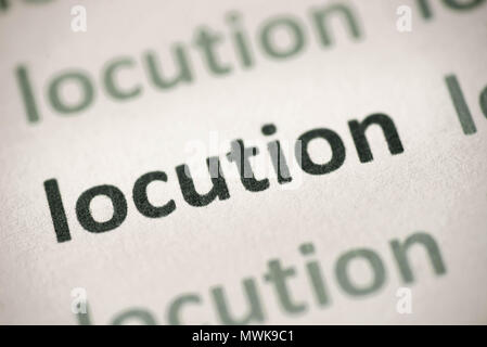 Locution mots imprimés sur papier blanc macro Banque D'Images