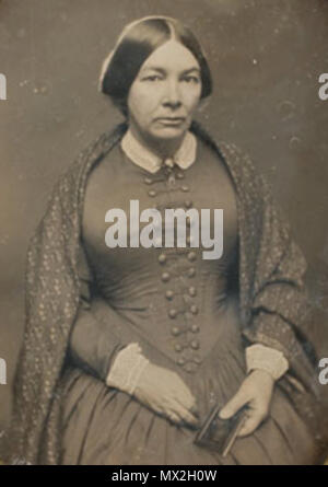 . 'Un daguerréotype portrait d'une femme assise, tenant un petit album ou cas daguerréotype dans sa main gauche, portant une bague de mariage à son doigt et d'un châle à motifs sur ses épaules, avec le 17 janvier 1852, rayé le long du périmètre inférieur gauche où la plaque se réunit le tapis, et à nouveau rayé le long de coins droit et gauche sous le paillasson, Cooley Springfield stamp sur mat' . 1852. Cooley 81852 byCooley Springfield woman portrait Banque D'Images