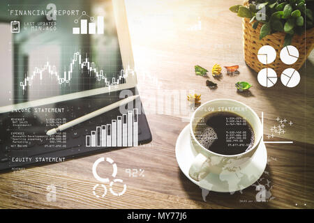 Les données du rapport financier de l'exploitation d'une entreprise (bilan et compte de résultat et le schéma) en tant que concept Fintech.tasse à café et table numérique sm dock Banque D'Images