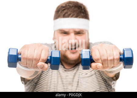 Portrait of young man holding dumbbells chubby isolated on white Banque D'Images