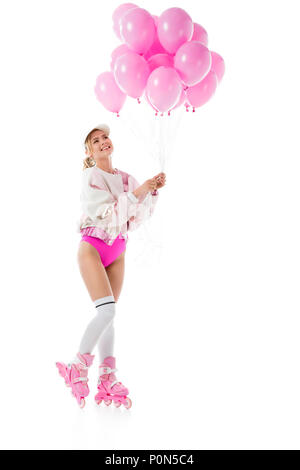 Young Girl wearing pink roller holding balloons isolated on white Banque D'Images