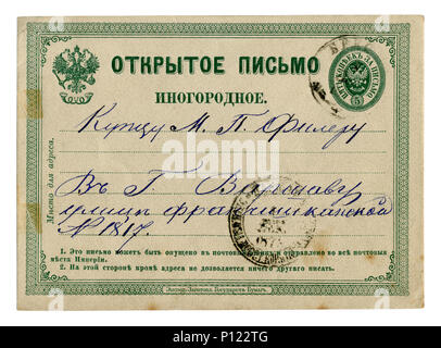 Carte postale historique russe : lettre à l'encre bleue à un commerçant, à Varsovie. Timbre imprimé, cachet de 1873, la Pologne, l'empire russe Banque D'Images