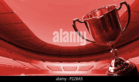 Thème rouge trophée avec arrière-plan flou football stadium Banque D'Images
