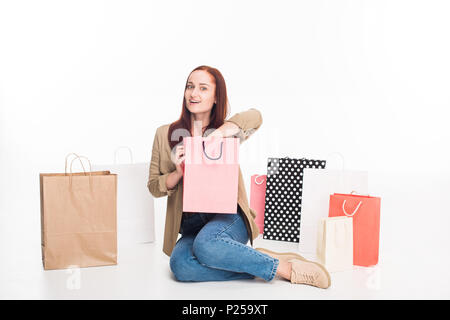 Belle surprise woman with shopping bags, isolated on white Banque D'Images
