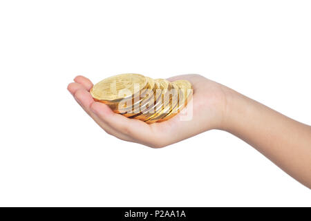 Children's hand holding golden fond blanc isolé en Bitcoin Banque D'Images