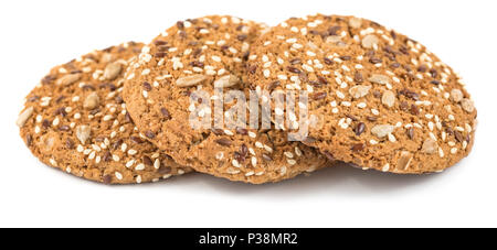 Oatmeal Cookies saupoudré de graines de tournesol, de lin et de graines de sésame. Pâtisseries sain isolé sur fond blanc Banque D'Images