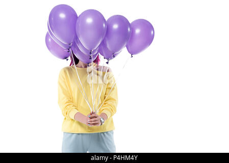 Woman covering face avec bouquet de ballons d'hélium isolated on white Banque D'Images